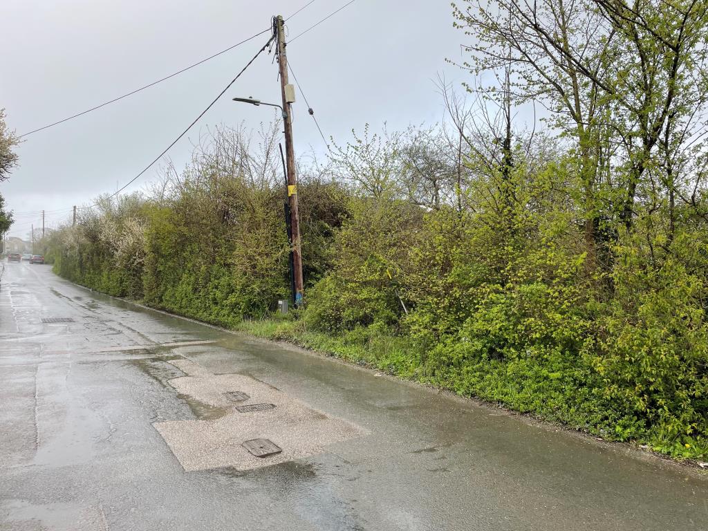 Lot: 18 - 13 PARCELS OF LAND WITH POTENTIAL IN STRATEGIC LOCATION - view of land from Mill Road